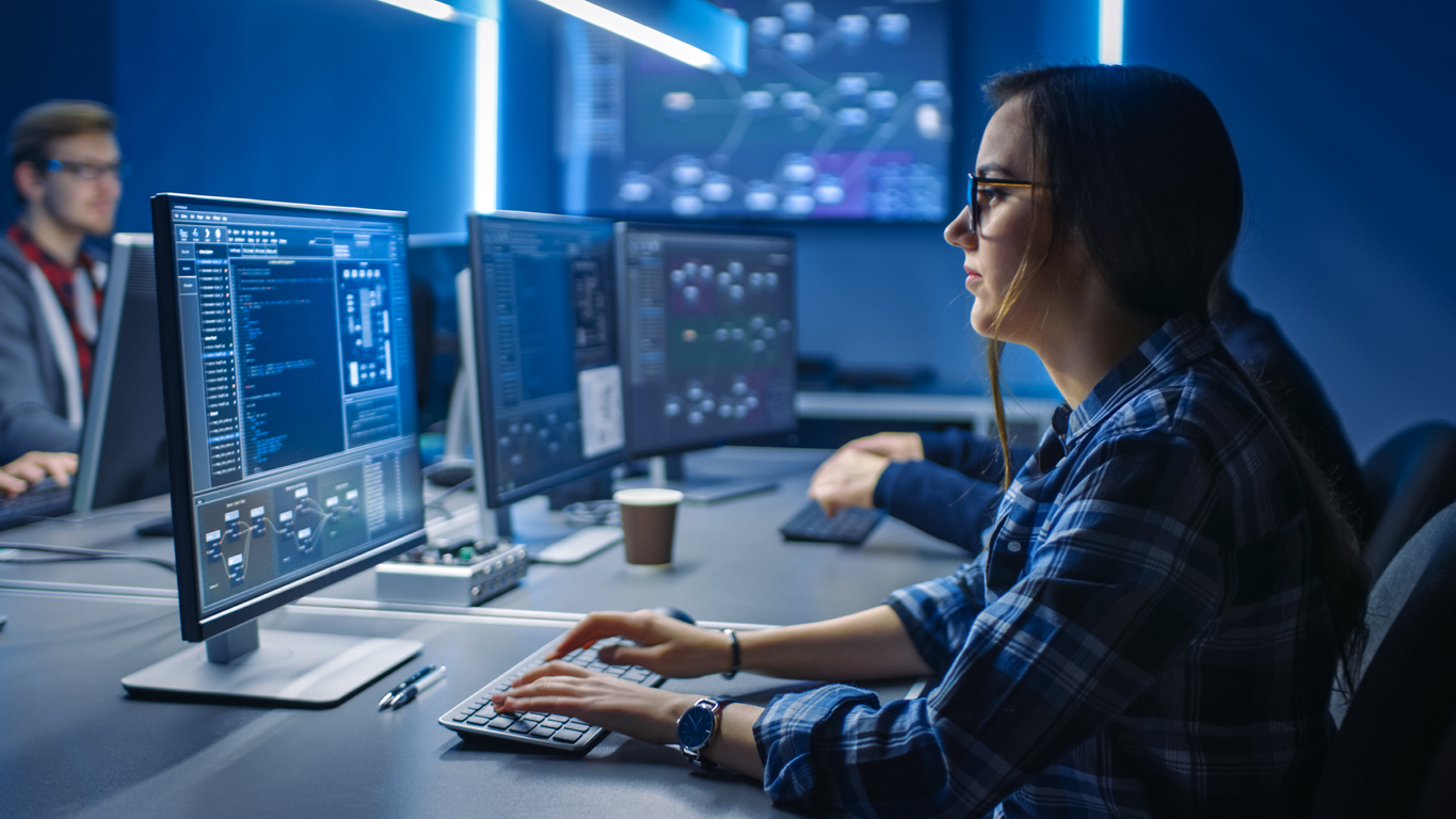 Cyber Security Incident Response & Support agent at a computer.